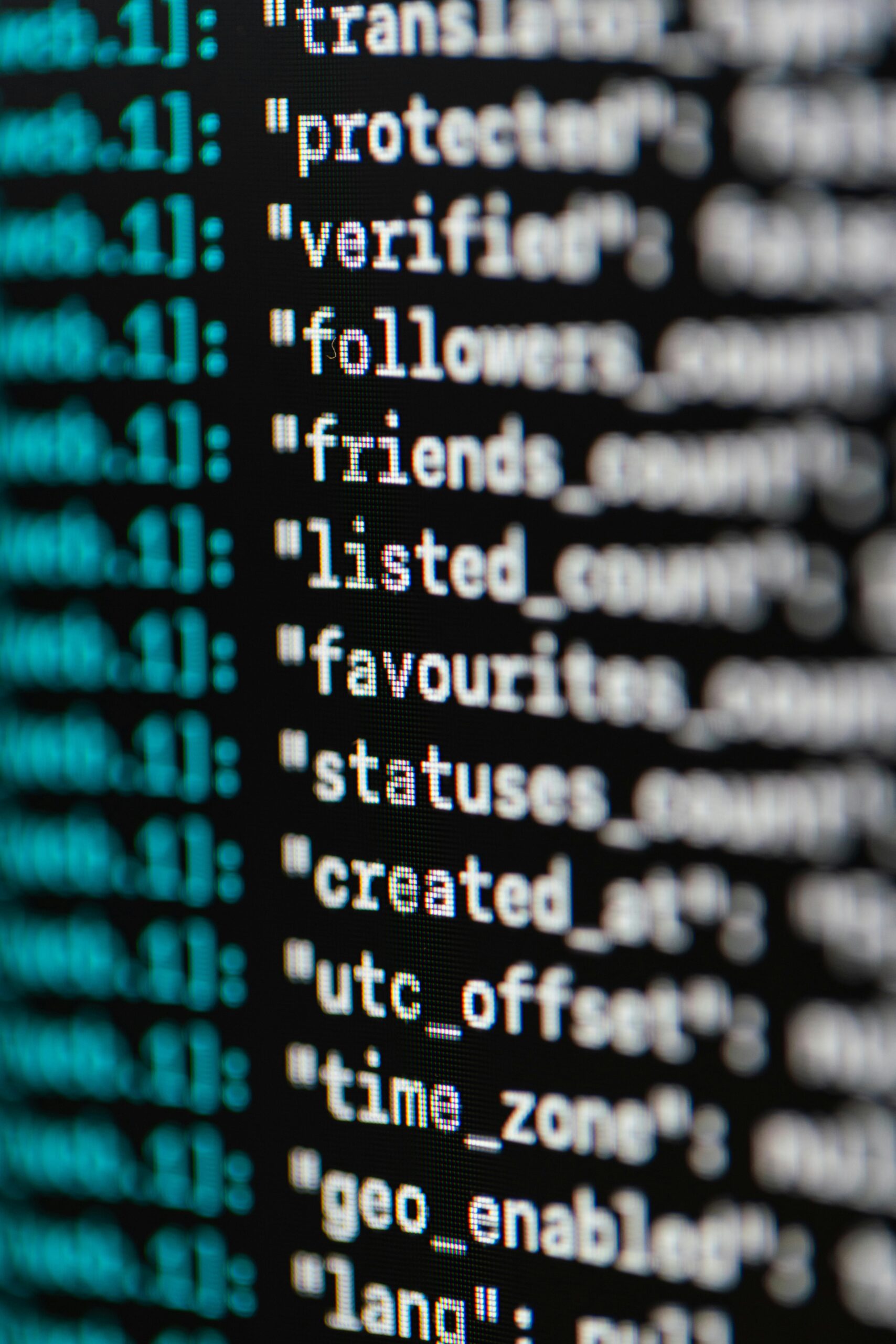 Close-up view of a computer screen showing colorful JavaScript code with syntax highlighting in multiple colors.